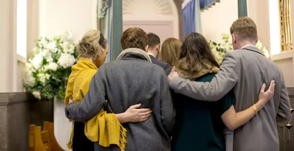 Group of people grieving